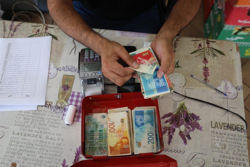 Palestinians are responding to Israel’s stranglehold on the West Bank economy by forgiving each other’s debts en masse
